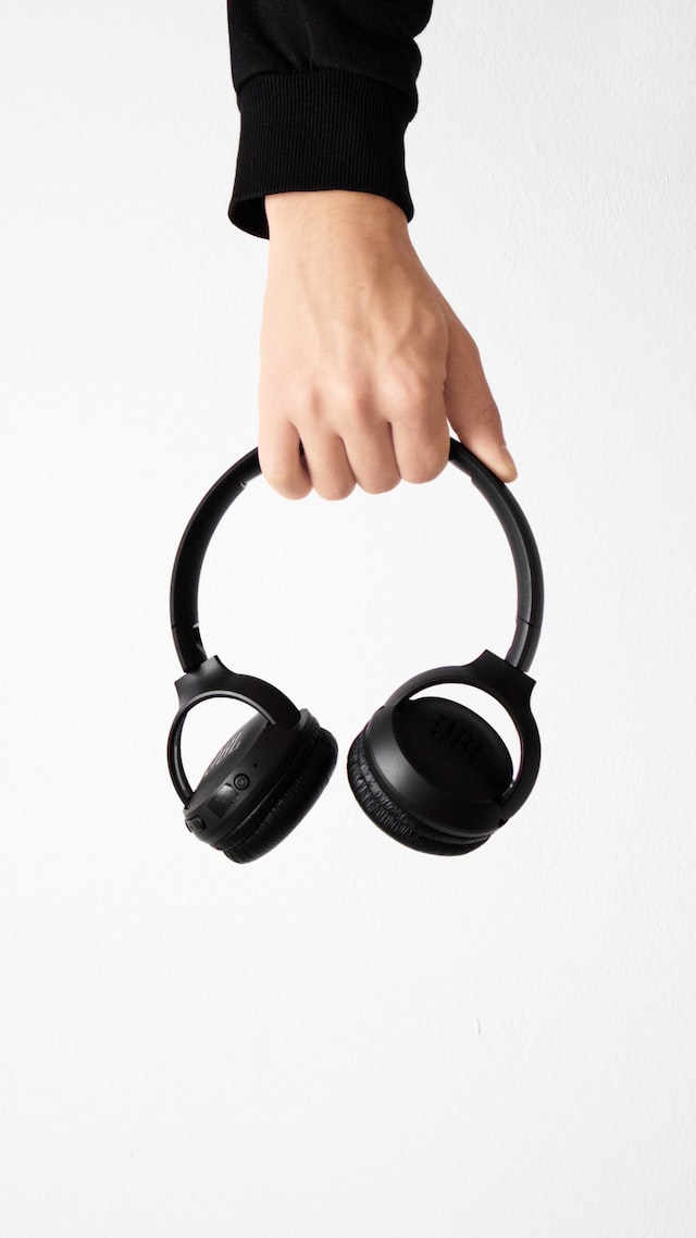 JBL Tune 510BT headphones with holding on hand